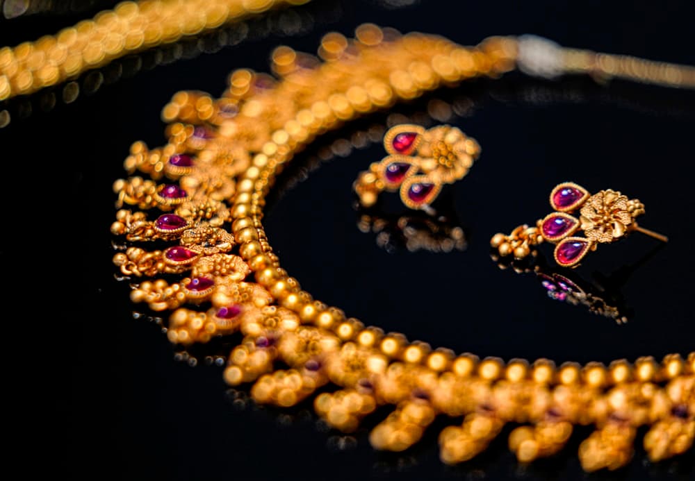 Traditional gold and ruby jewelry handcrafted in the Kundan style